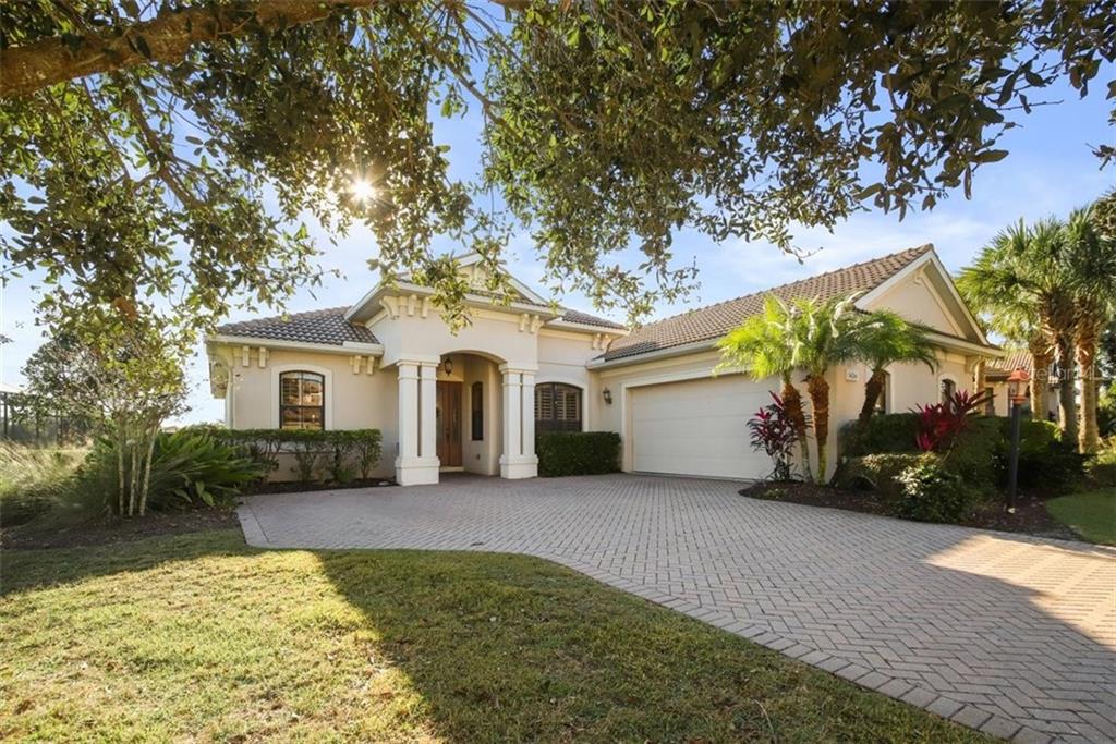 14261 Sundial Place Lakewood Ranch, FL 34202 - Photo 1 of 1 a view of a house with a yard and large tree