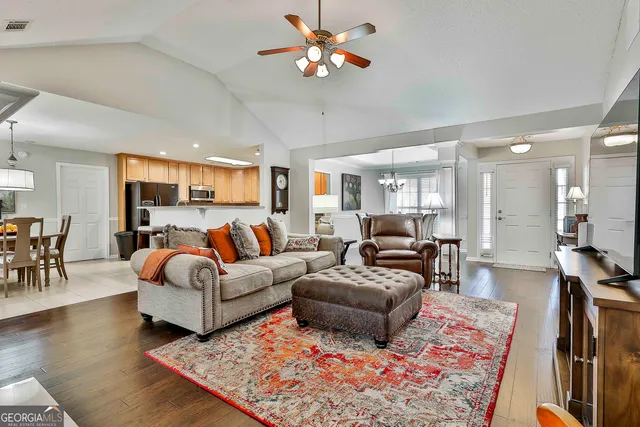 a living room with furniture fireplace and a table
