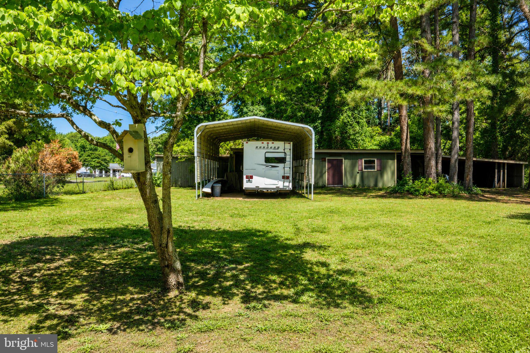 610 Beach Road White Stone, VA 22578 - Photo 17 of 23 Spacious yard with RV shelter charm.