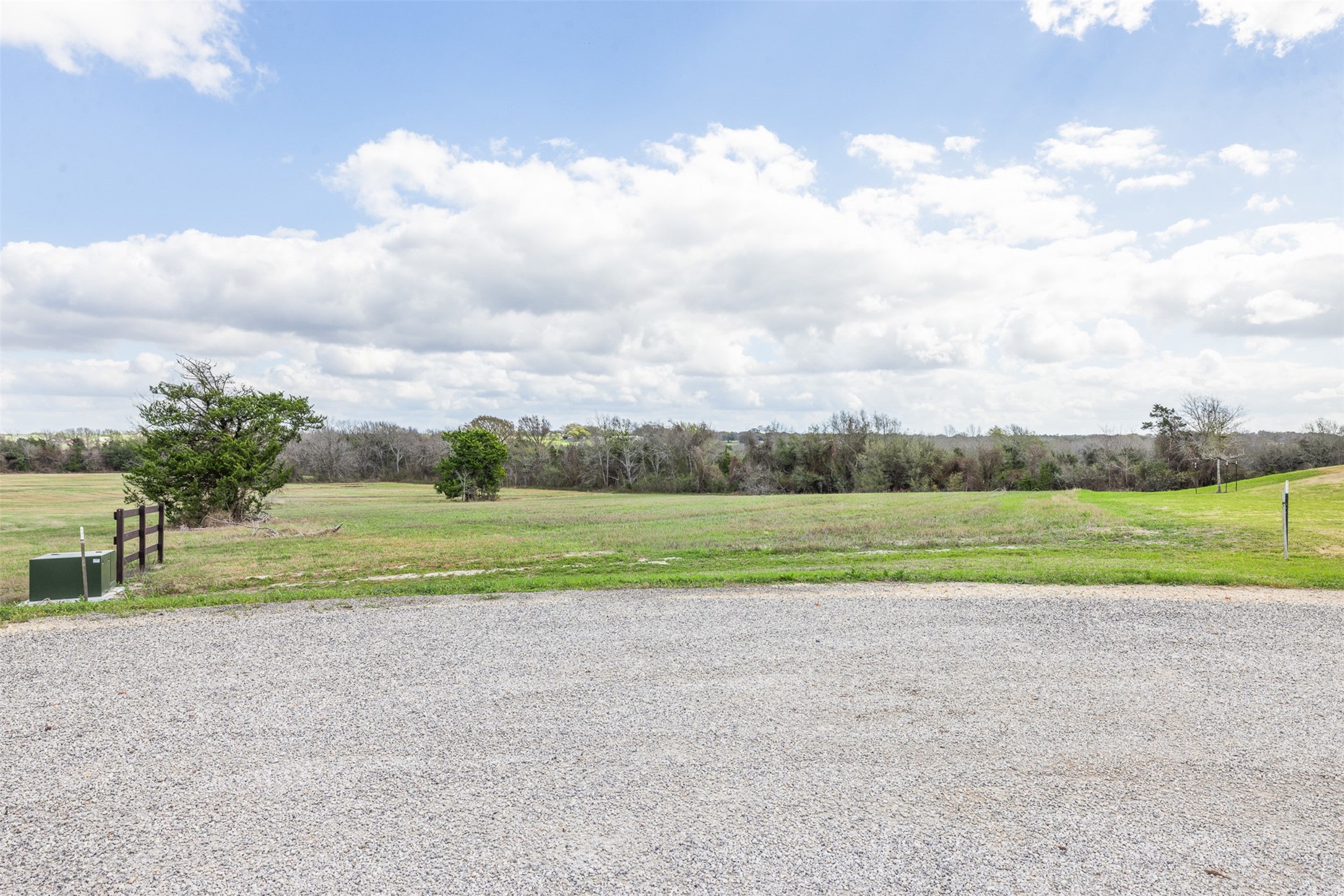 115 Turney Trace Round Top, TX 78954 - Photo 2 of 9 a view of field and trees in the background