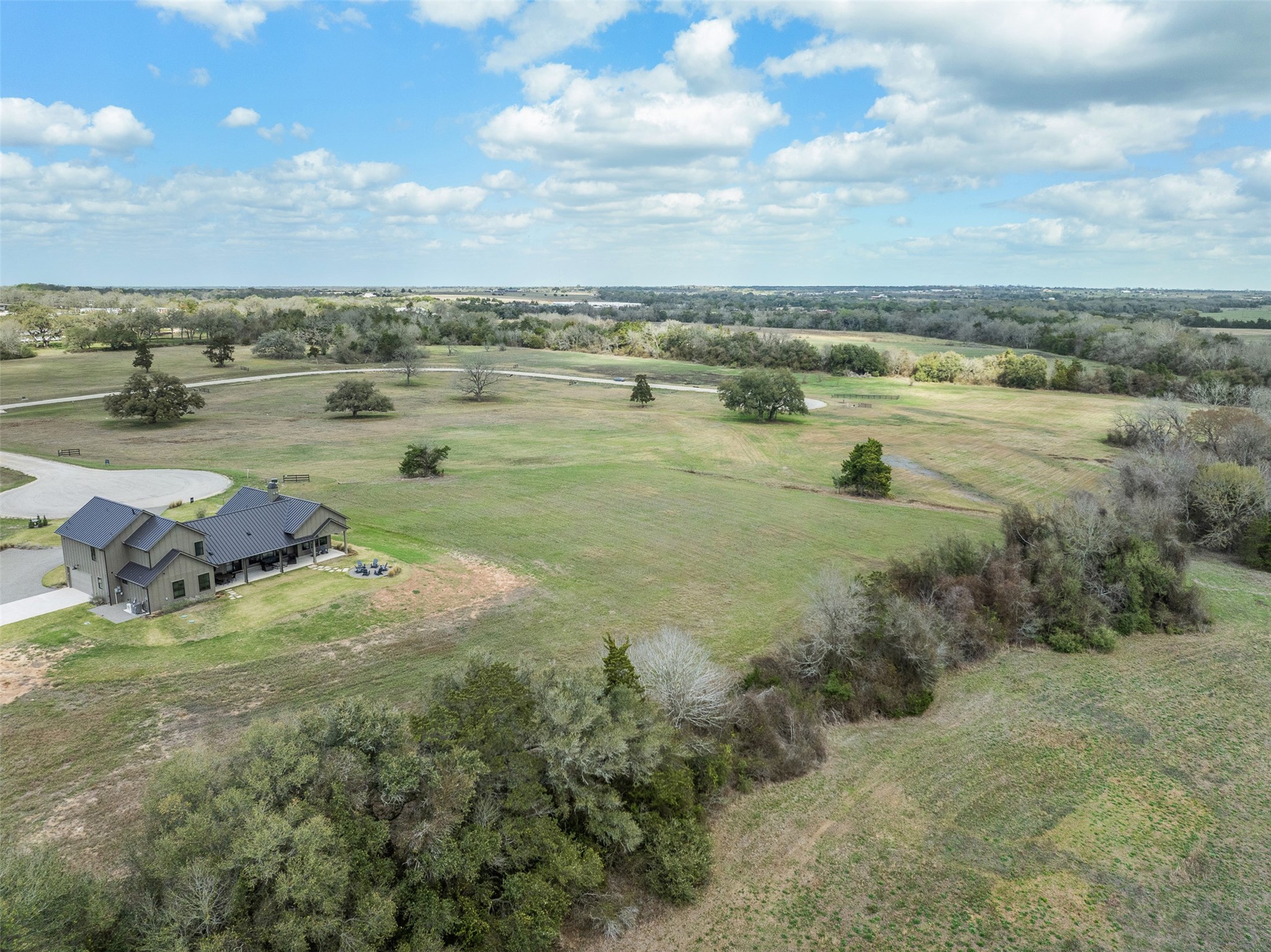115 Turney Trace Round Top, TX 78954 - Photo 7 of 9 a view of a lake with outdoor space