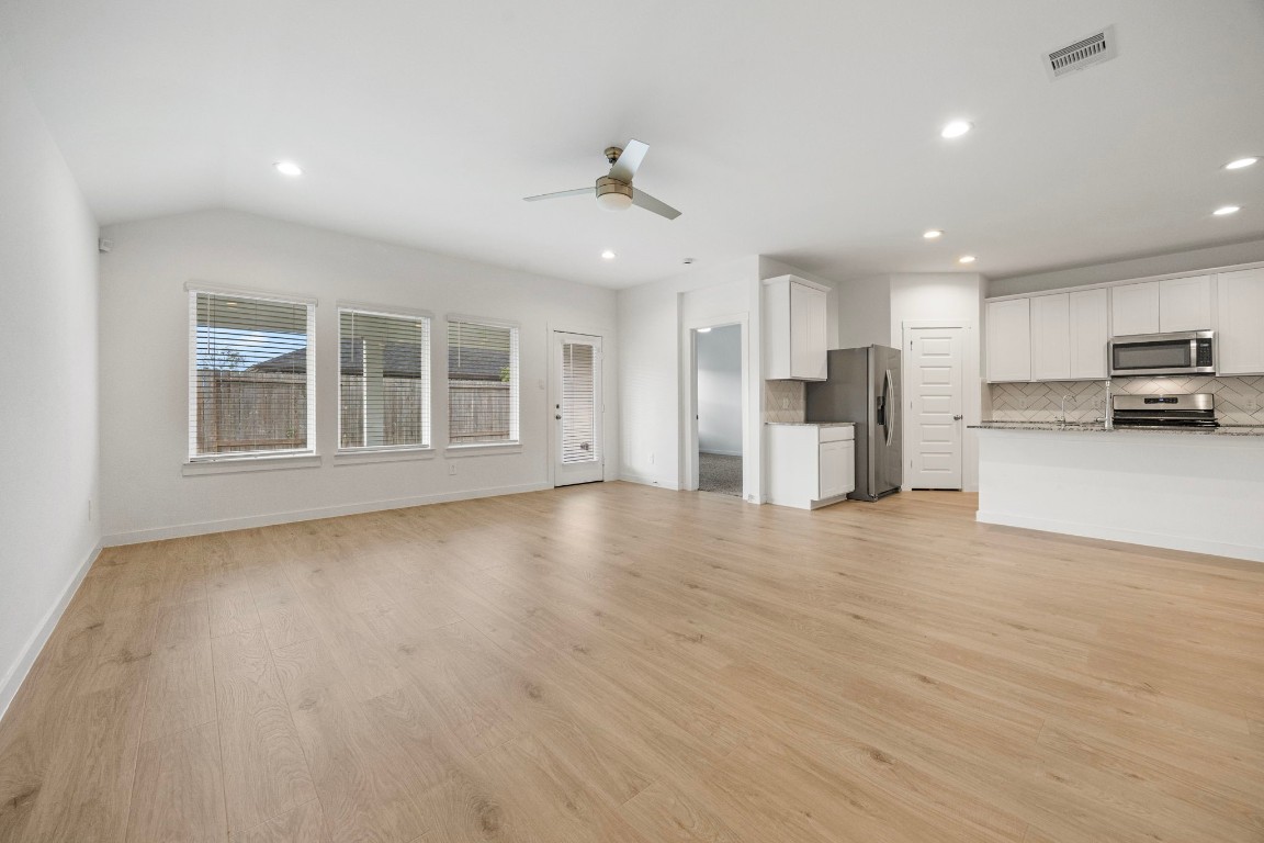 2732 Misty Elm Lane Rosenberg, TX 77469 - Photo 15 of 30 a view of a kitchen with a sink and a refrigerator
