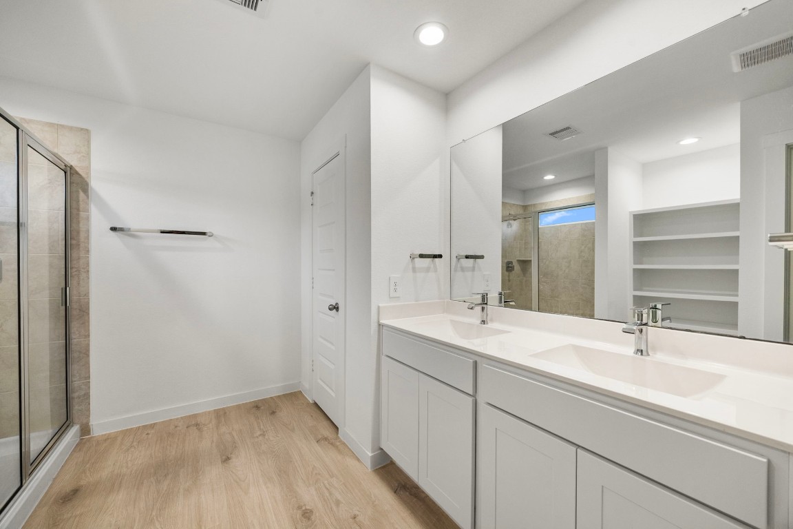 2732 Misty Elm Lane Rosenberg, TX 77469 - Photo 19 of 30 a bathroom with a sink and a mirror