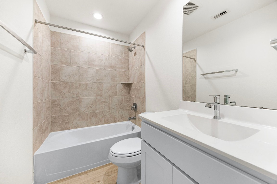 2732 Misty Elm Lane Rosenberg, TX 77469 - Photo 24 of 30 a bathroom with a sink a toilet and a bathtub