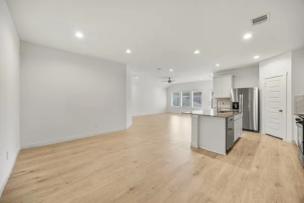 a view of kitchen with wooden floor