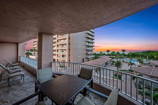 a view of a balcony with furniture