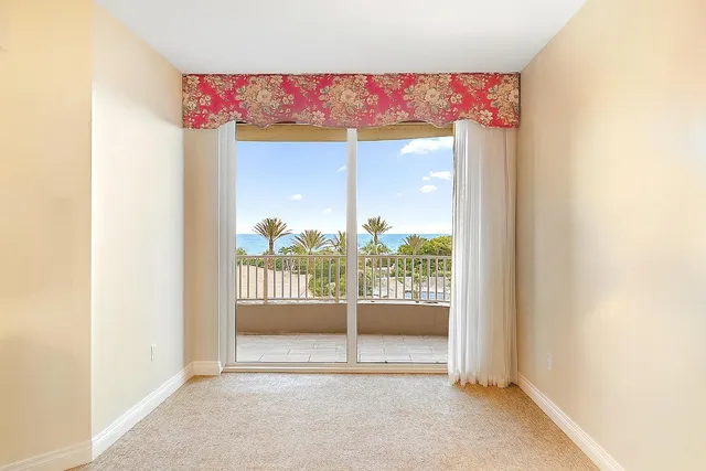 a view of a room that has a bed and a window