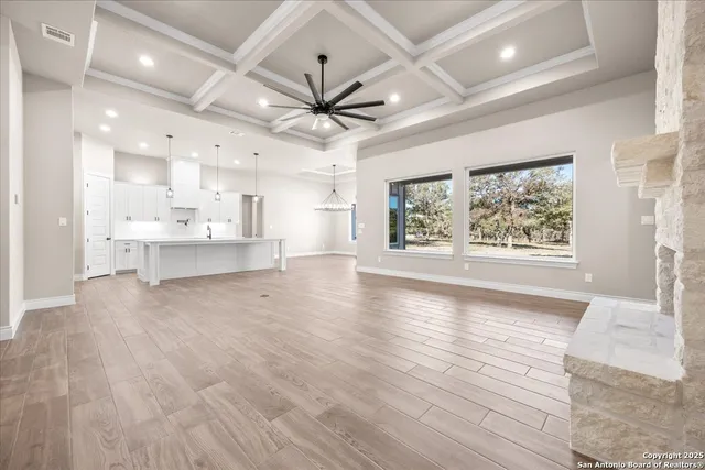 a bathroom with a sink a mirror a vanity and shower