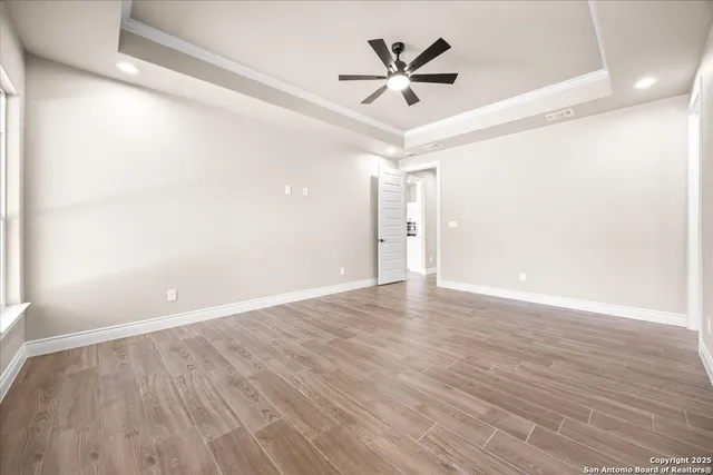 a view of a livingroom with a furniture and chandelier fan