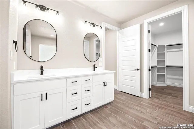 a front view of a house with a yard covered with snow