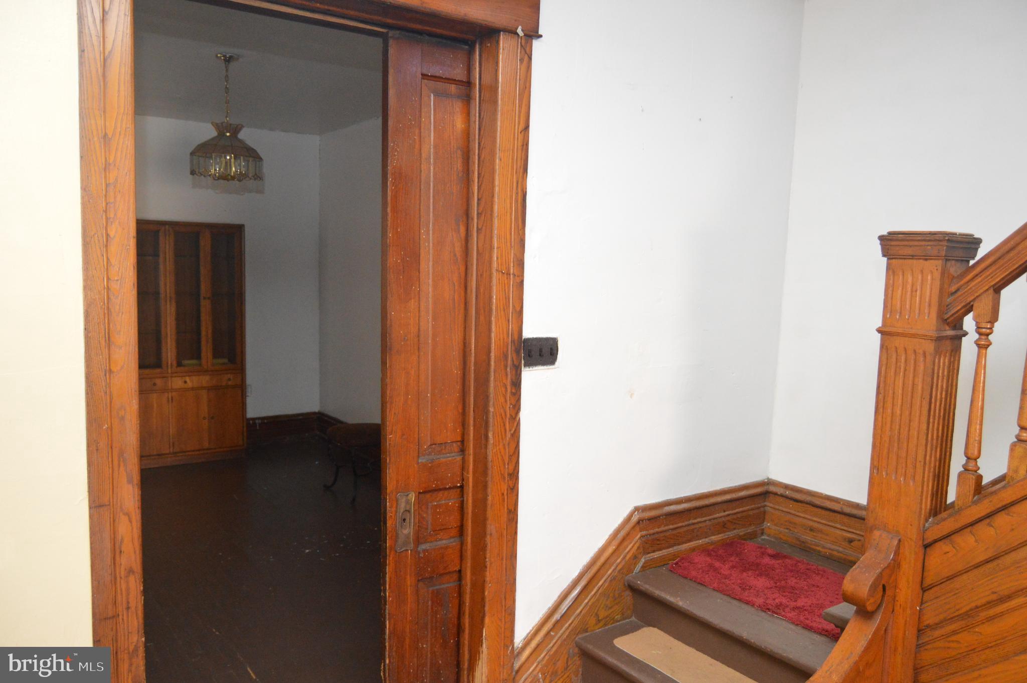 802 Chestnut Street Reading, PA 19602 - Photo 7 of 38 Pocket door between Living and Dining Rooms