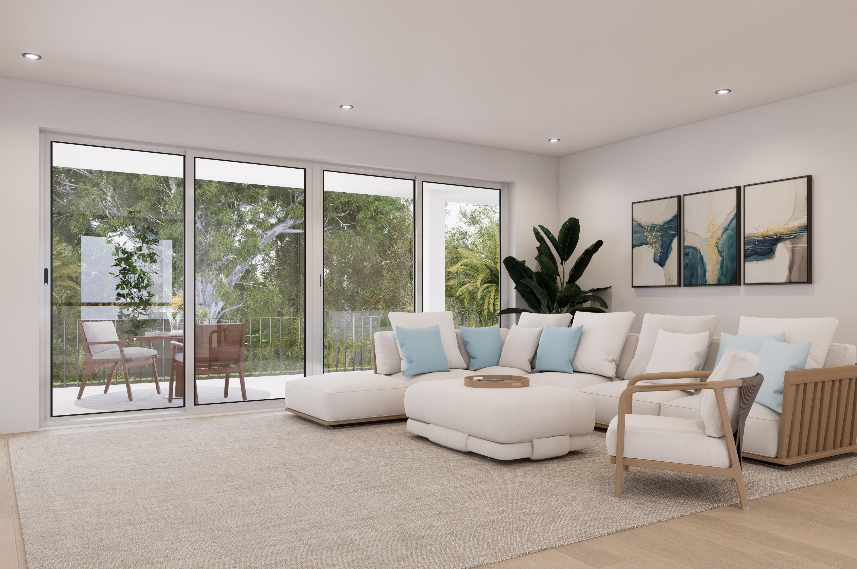 1041 Bimini Lane Singer Island, FL 33404 - Photo 16 of 26 a living room with furniture and a large window