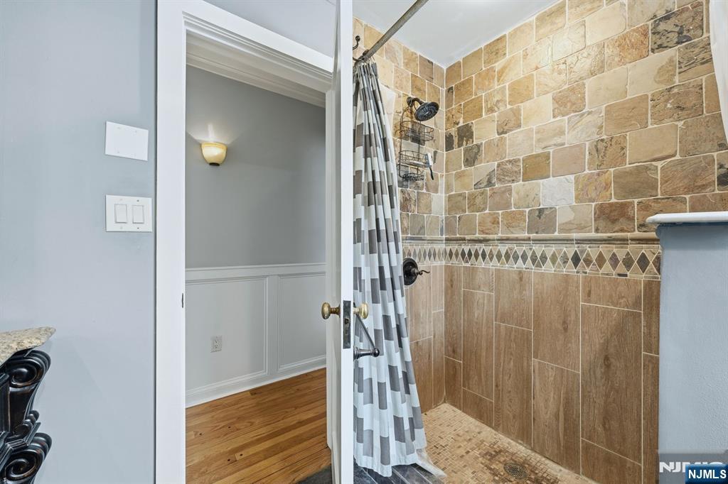 207 Elm Avenue Hackensack, NJ 07601 - Photo 12 of 38 a bathroom with a shower