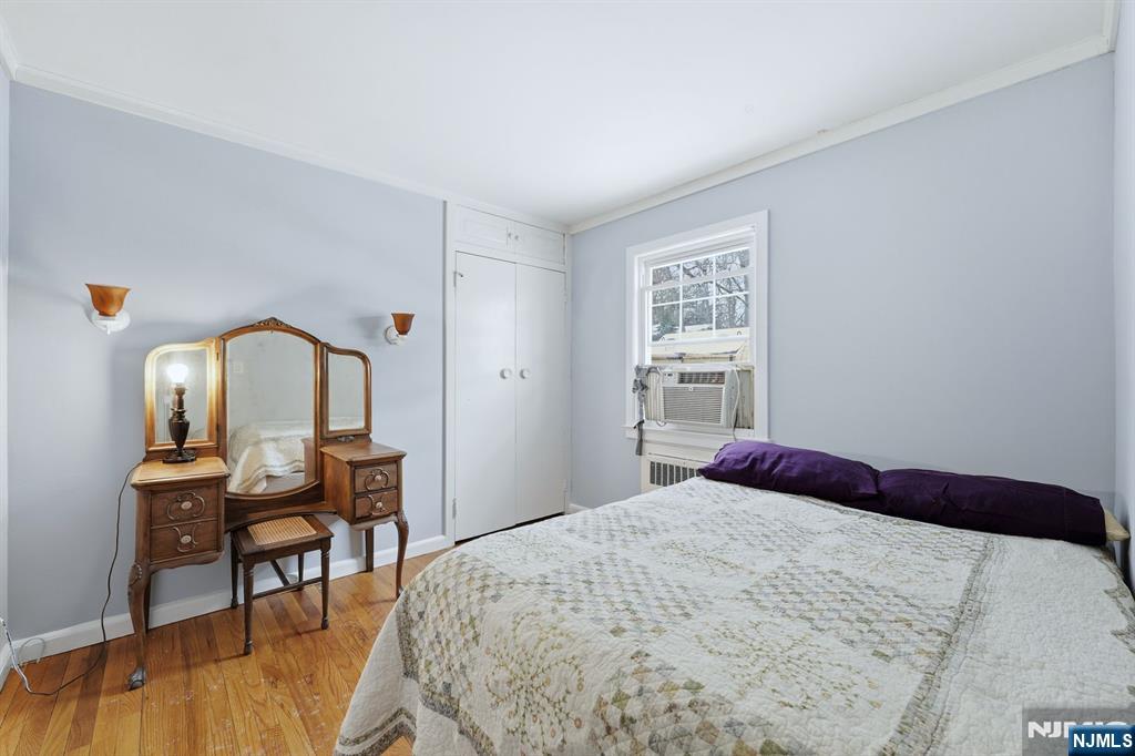 207 Elm Avenue Hackensack, NJ 07601 - Photo 13 of 38 a bedroom with a bed and a table