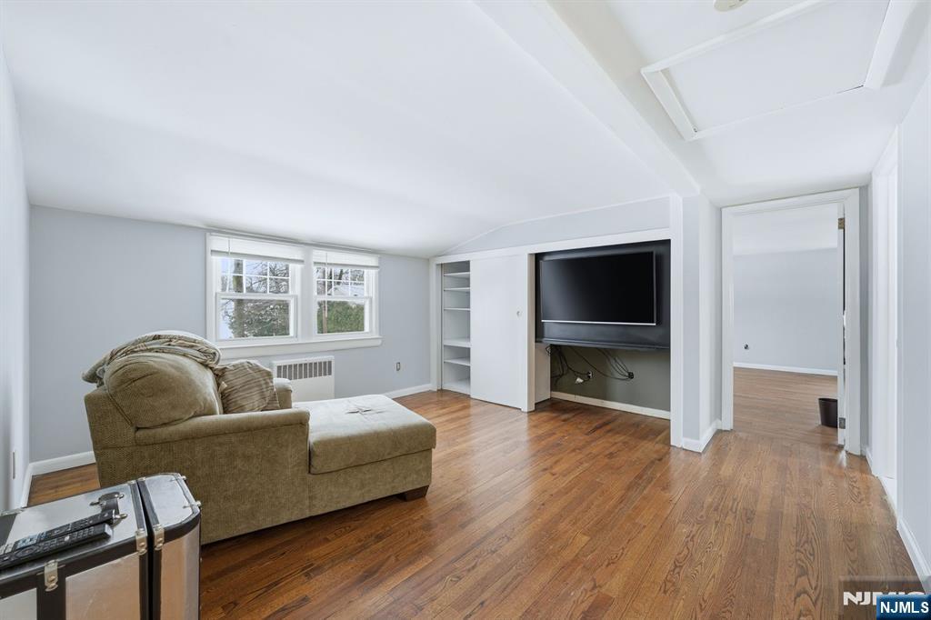 207 Elm Avenue Hackensack, NJ 07601 - Photo 15 of 38 a living room with furniture and a flat screen tv