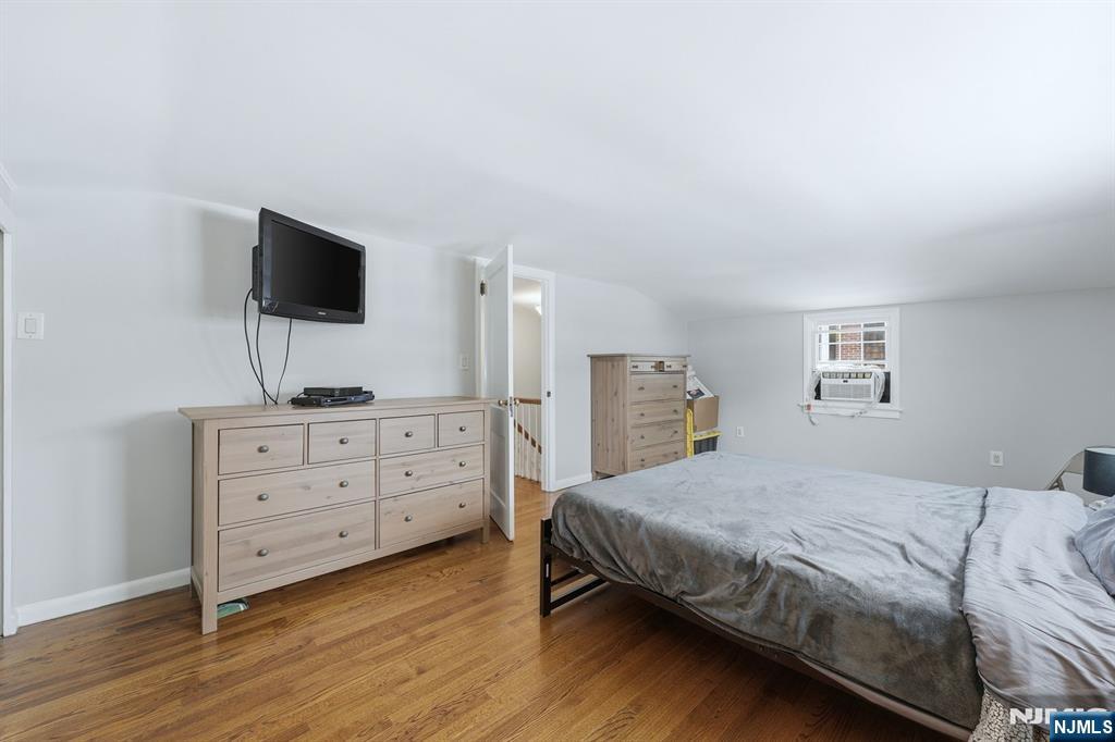 207 Elm Avenue Hackensack, NJ 07601 - Photo 20 of 38 a bedroom with a bed and a flat screen tv