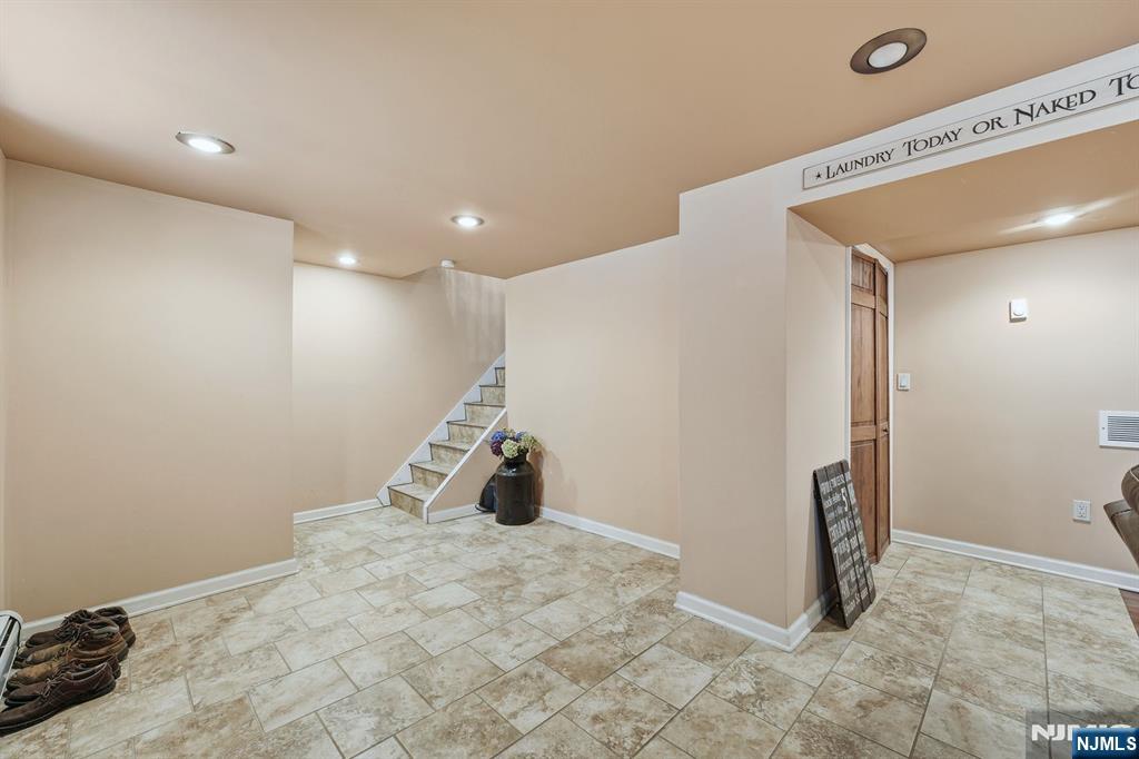 207 Elm Avenue Hackensack, NJ 07601 - Photo 23 of 38 a view of a storage & utility room with two washing machine