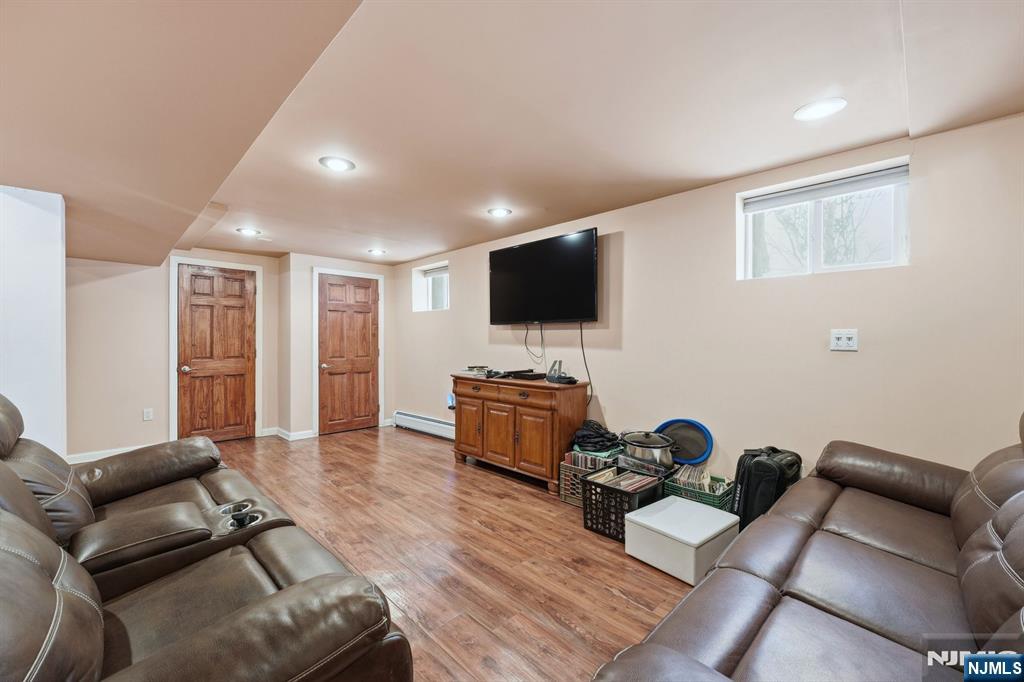 207 Elm Avenue Hackensack, NJ 07601 - Photo 24 of 38 a living room with furniture and a flat screen tv
