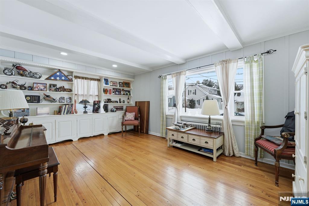 207 Elm Avenue Hackensack, NJ 07601 - Photo 3 of 38 a living room with furniture and a book shelf