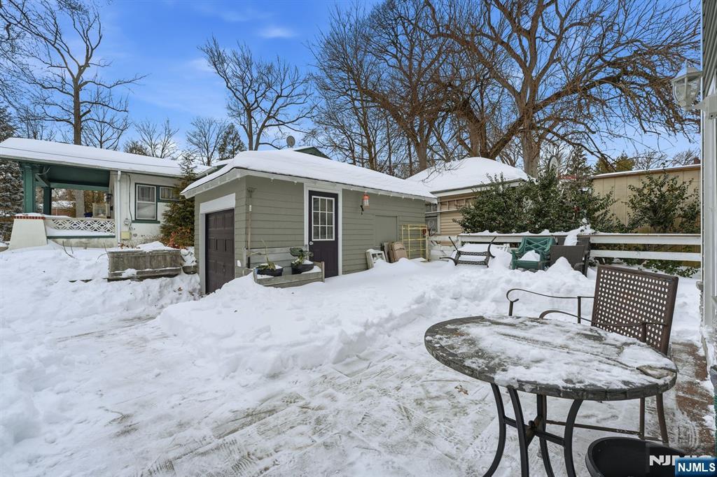 207 Elm Avenue Hackensack, NJ 07601 - Photo 31 of 38 a view of a patio with a table and chairs under an umbrella