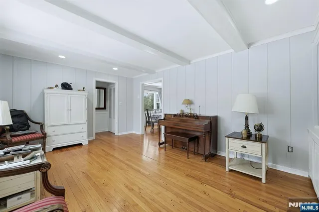 a bed room with a bed and a chair in it