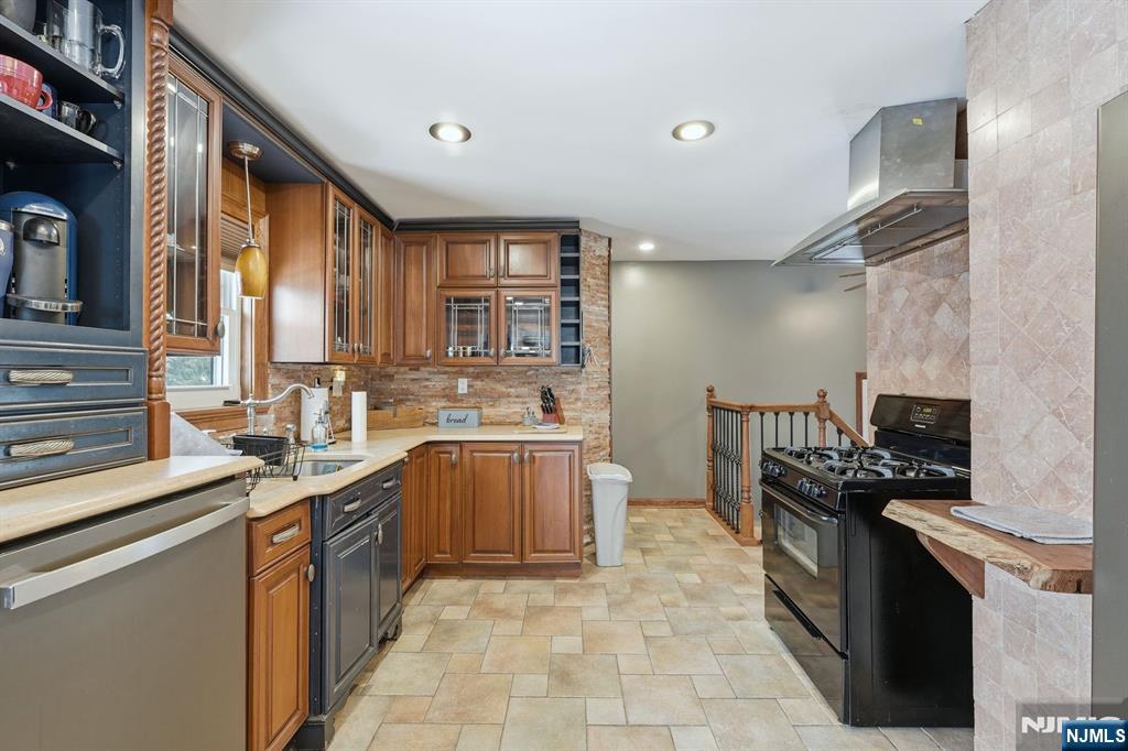 207 Elm Avenue Hackensack, NJ 07601 - Photo 7 of 38 a kitchen with stainless steel appliances granite countertop a sink stove and refrigerator