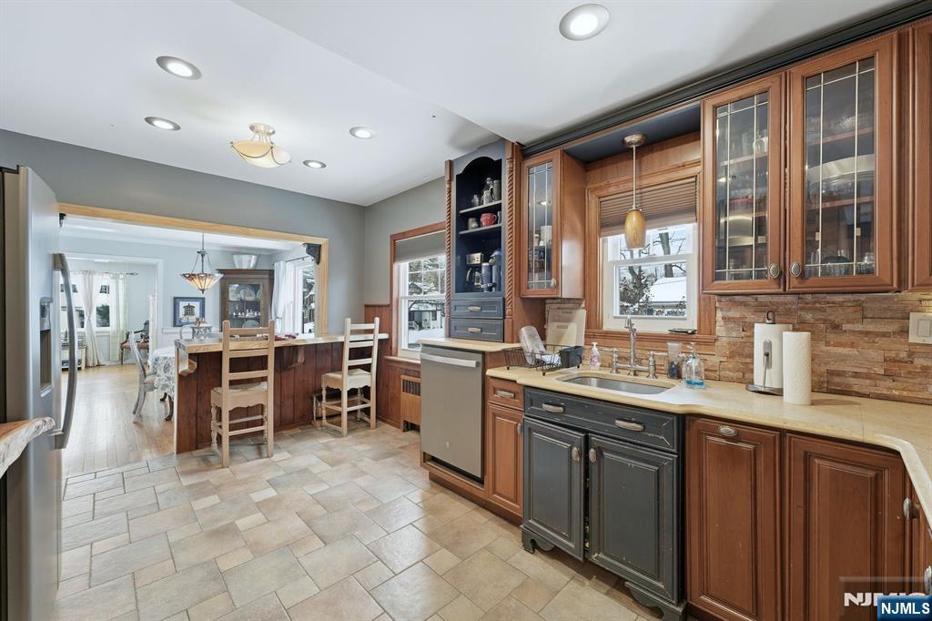 207 Elm Avenue Hackensack, NJ 07601 - Photo 9 of 38 a large kitchen with lots of counter space and furniture
