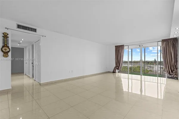 a view of an empty room and window