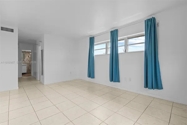 a view of an empty room and window