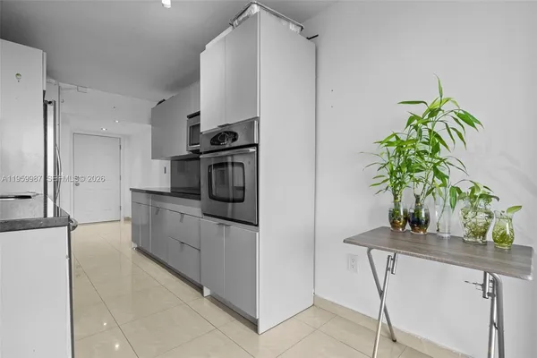 a kitchen with stainless steel appliances a counter space and cabinets
