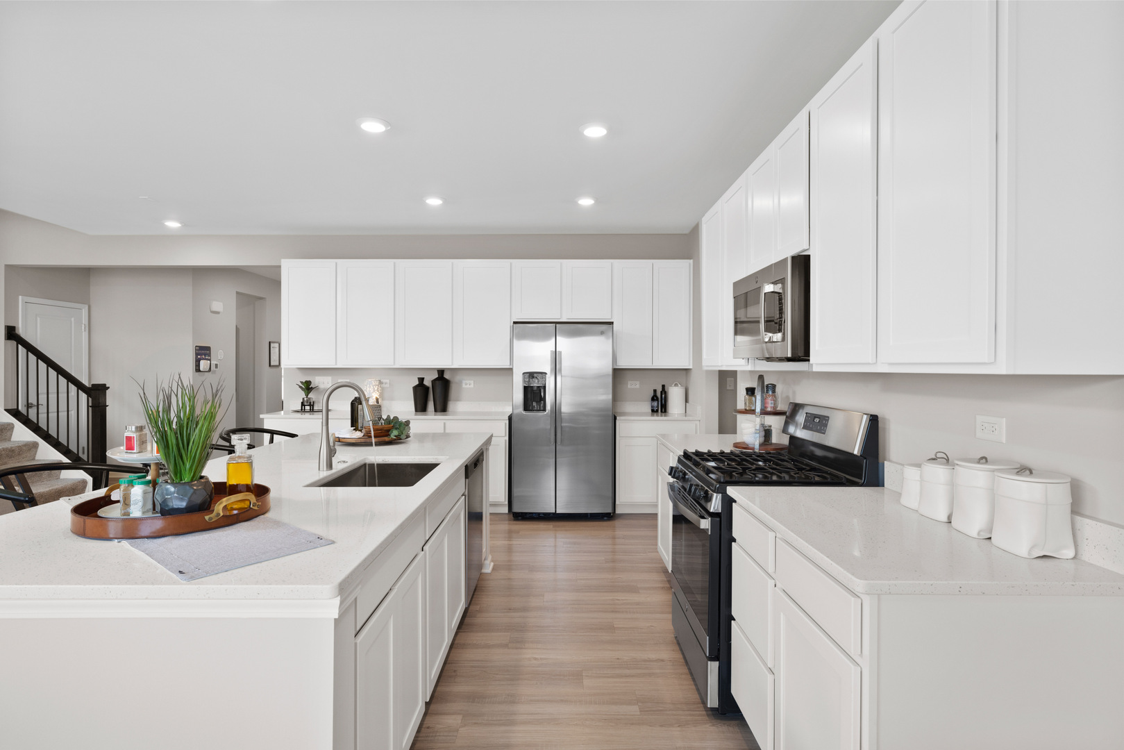 360 Cold Spg Street Algonquin, IL 60102 - Photo 4 of 18 a kitchen with stainless steel appliances a stove a sink a refrigerator a center island and cabinets