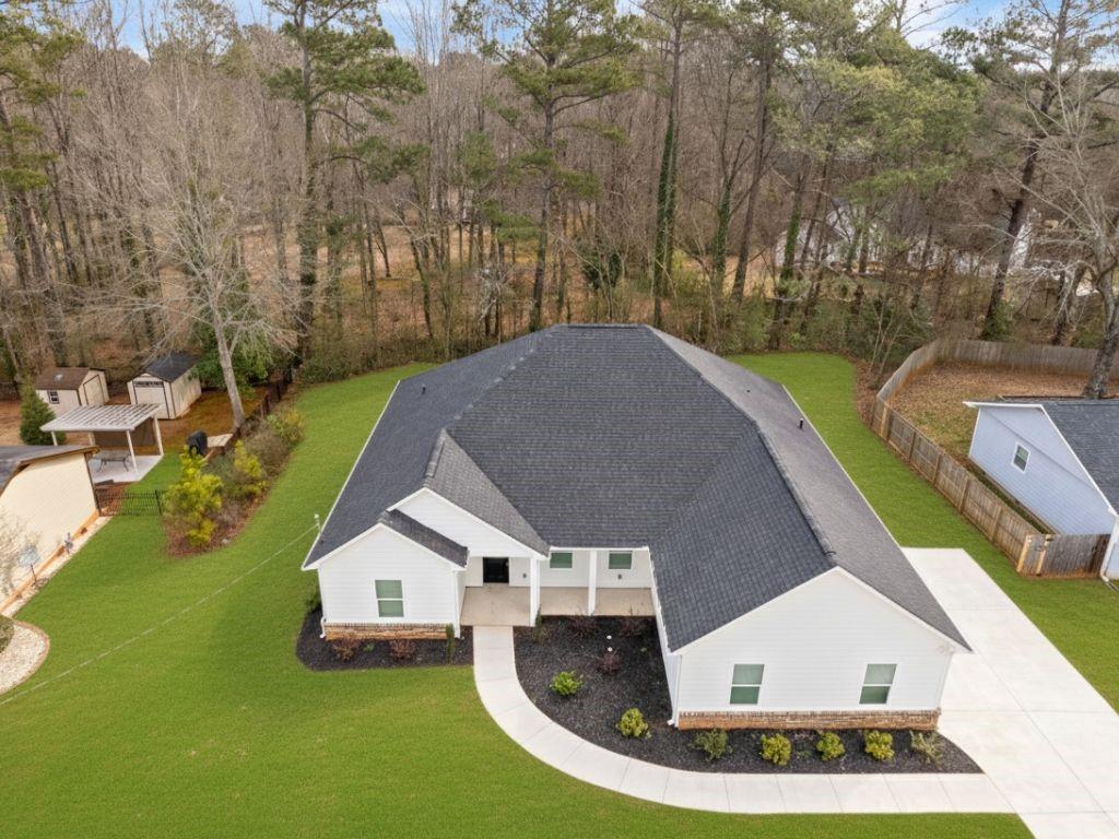 3272 Corktree Trail Lithonia, GA 30038 - Photo 22 of 22 a view of a house with a yard and trees