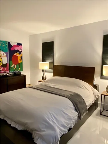 a bathroom with a shower and a mirror