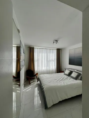 a view of a swimming pool with chair and table