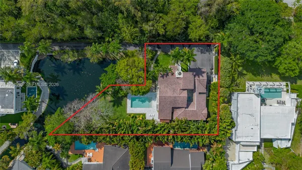 an aerial view of a house with a garden and plants