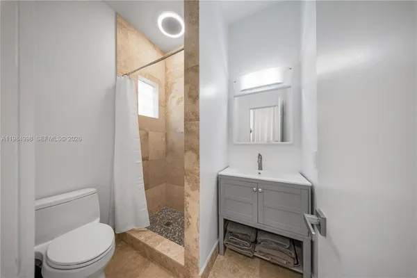 a view of a swimming pool with a yard and a fountain