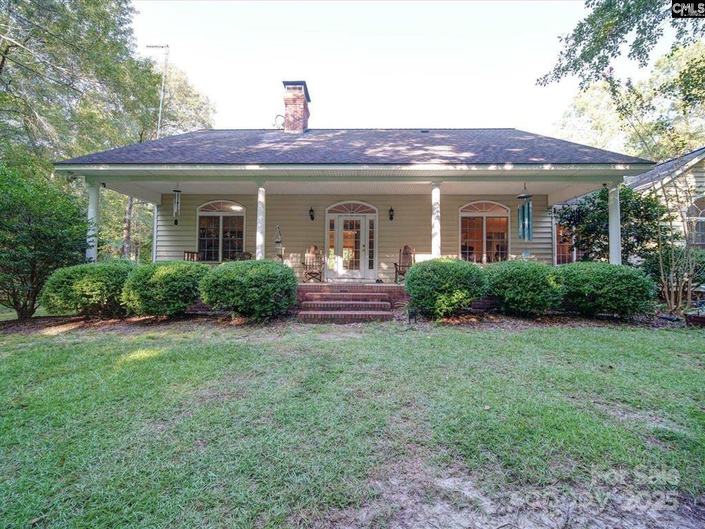 1239 John G Richards Road Camden, SC 29020 - Photo 13 of 30 a front view of a house with garden