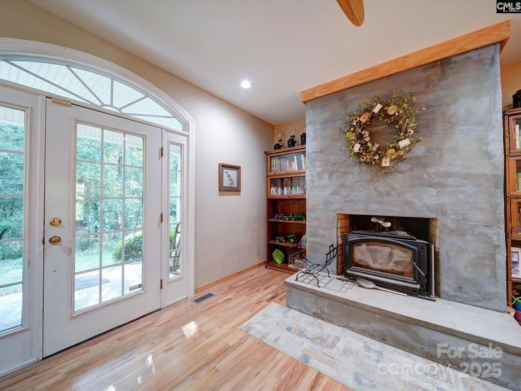 1239 John G Richards Road Camden, SC 29020 - Photo 15 of 30 a living room with furniture and a fireplace