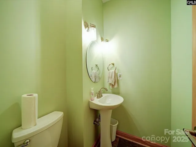 a bathroom with a sink and mirror