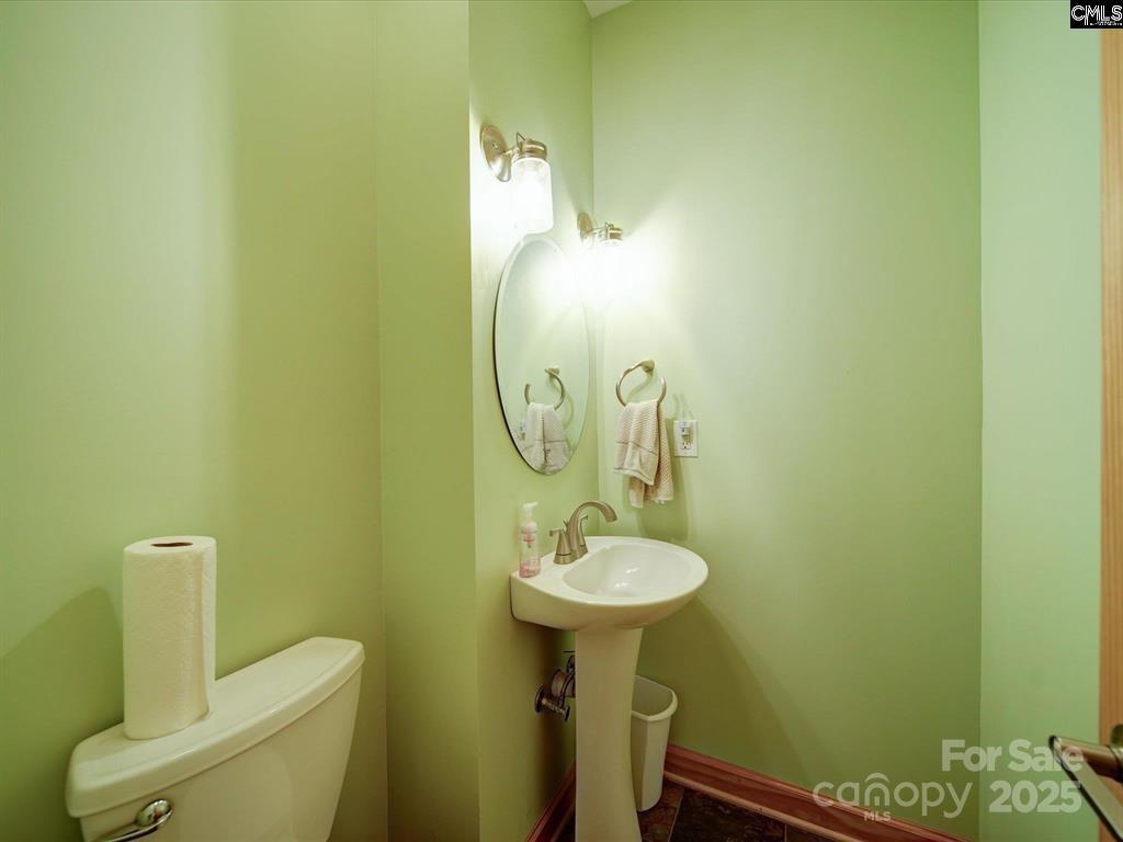1239 John G Richards Road Camden, SC 29020 - Photo 23 of 30 a bathroom with a sink and mirror