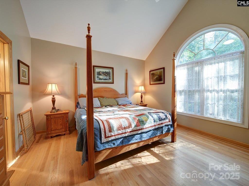 1239 John G Richards Road Camden, SC 29020 - Photo 27 of 30 a bedroom with a bed and a large window