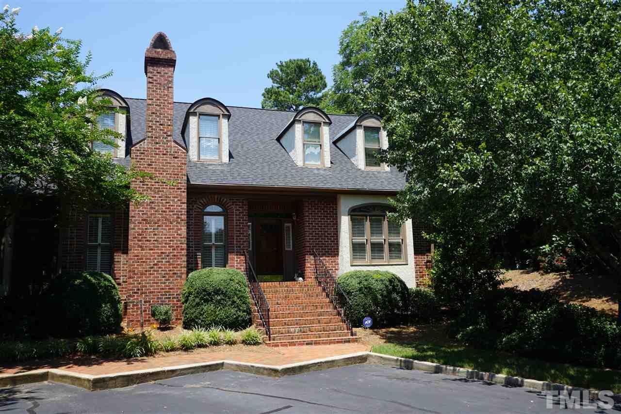 3330 Ridgecrest Court Raleigh, NC 27607 - Photo 1 of 25 a front view of a house with a yard and potted plants