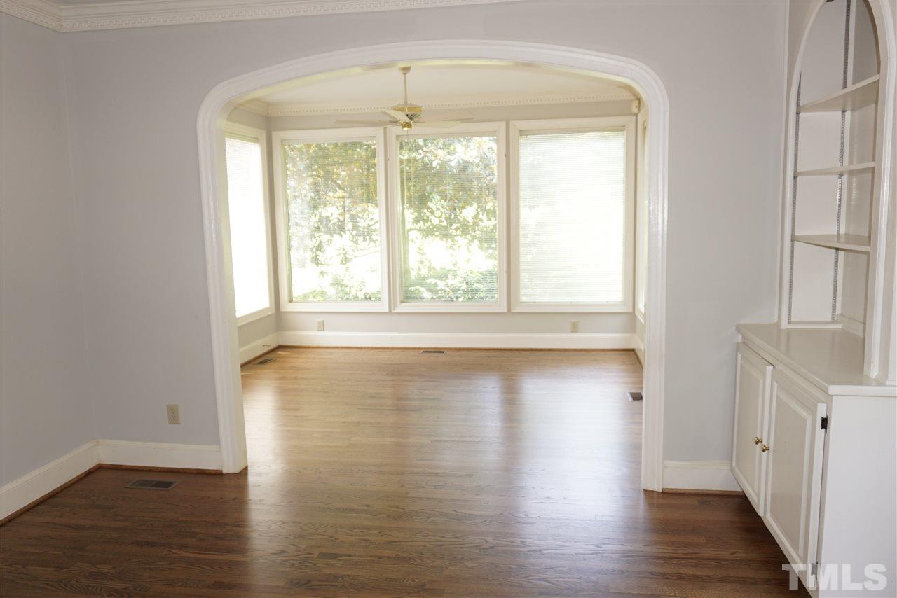 3330 Ridgecrest Court Raleigh, NC 27607 - Photo 11 of 25 a view of empty room with wooden floor and fan