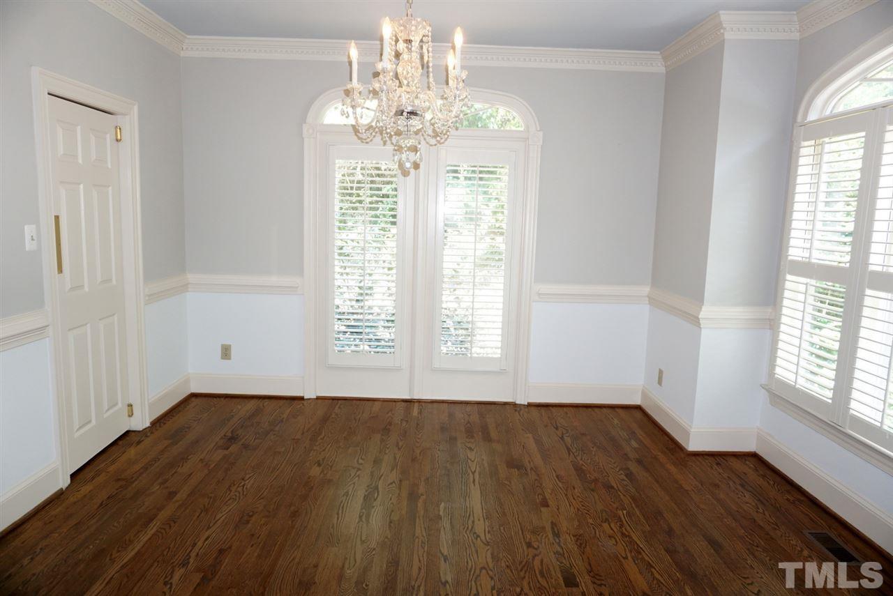 3330 Ridgecrest Court Raleigh, NC 27607 - Photo 6 of 25 wooden floor in an empty room with a window