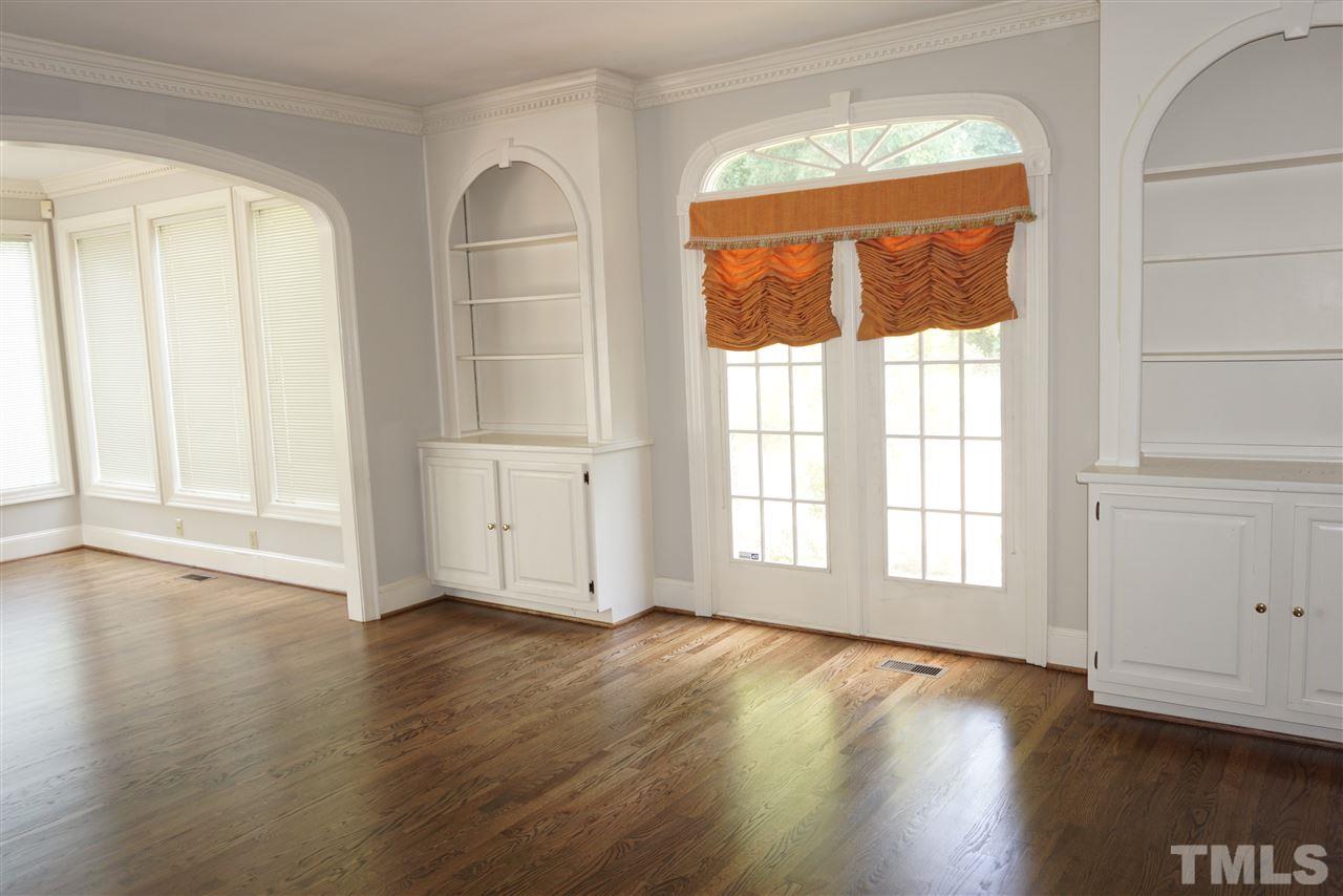 3330 Ridgecrest Court Raleigh, NC 27607 - Photo 10 of 25 an empty room with wooden floor and windows