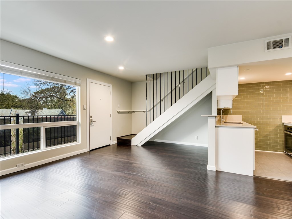 3110 Red River Street, Unit 221 Austin, TX 78705 - Photo 1 of 1 a view of empty room with wooden floor and fan