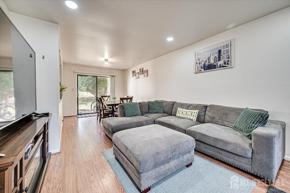 602 Maplecrest Road Edison, NJ 08820 - Photo 11 of 42 a living room with furniture and a flat screen tv