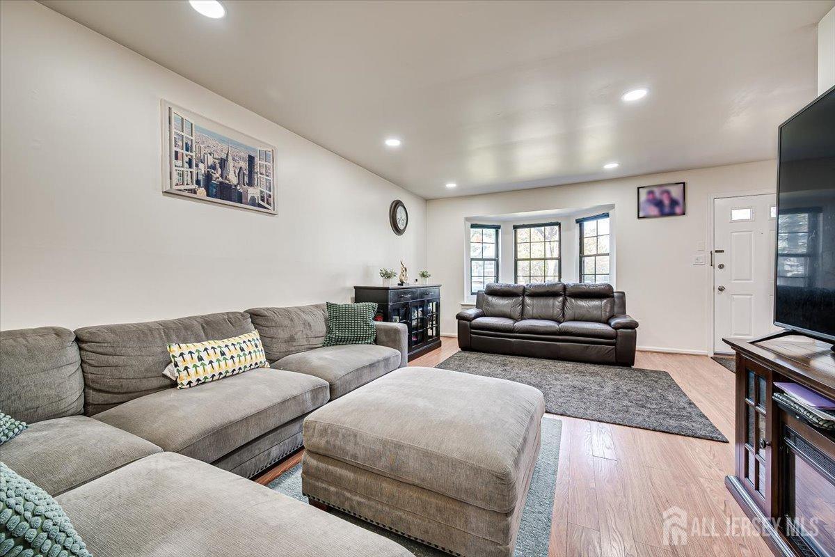 602 Maplecrest Road Edison, NJ 08820 - Photo 13 of 42 a living room with furniture and a flat screen tv