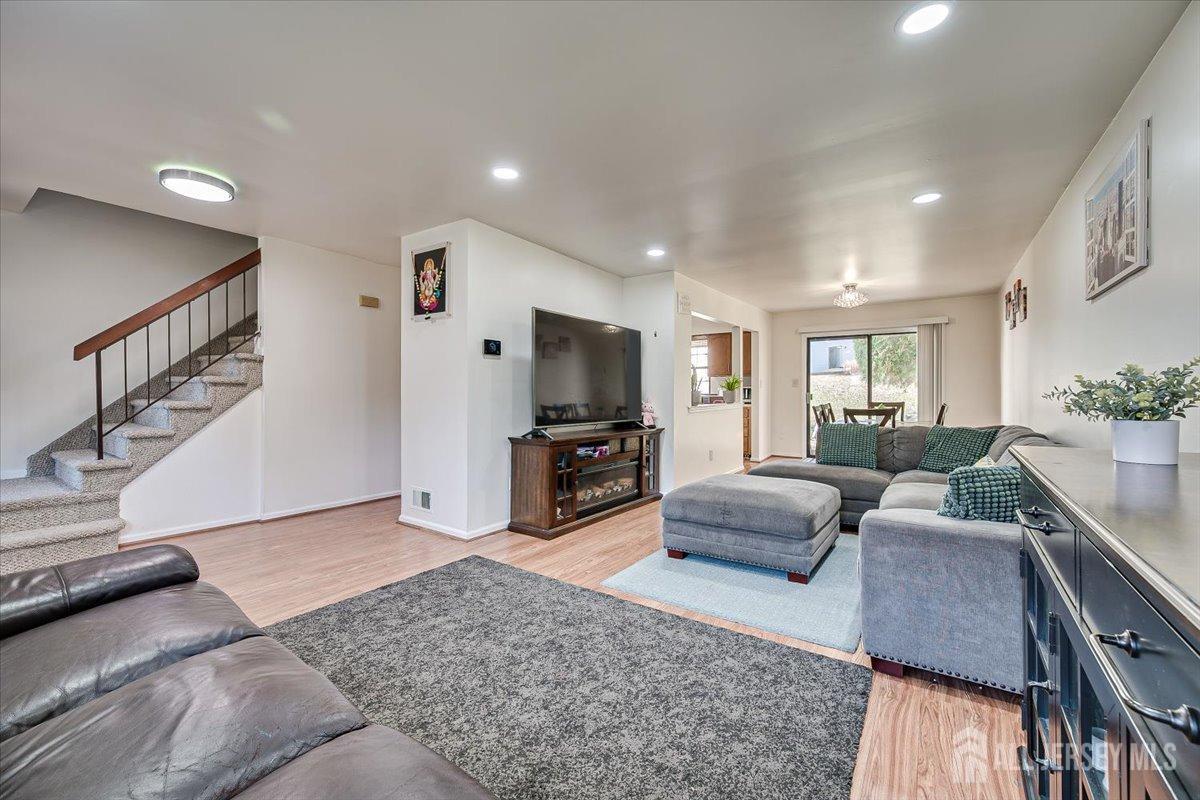 602 Maplecrest Road Edison, NJ 08820 - Photo 14 of 42 a living room with furniture and a flat screen tv