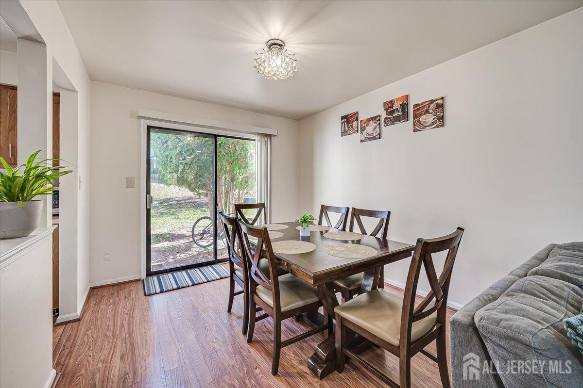 602 Maplecrest Road Edison, NJ 08820 - Photo 15 of 42 a view of a dining room with furniture window and wooden floor